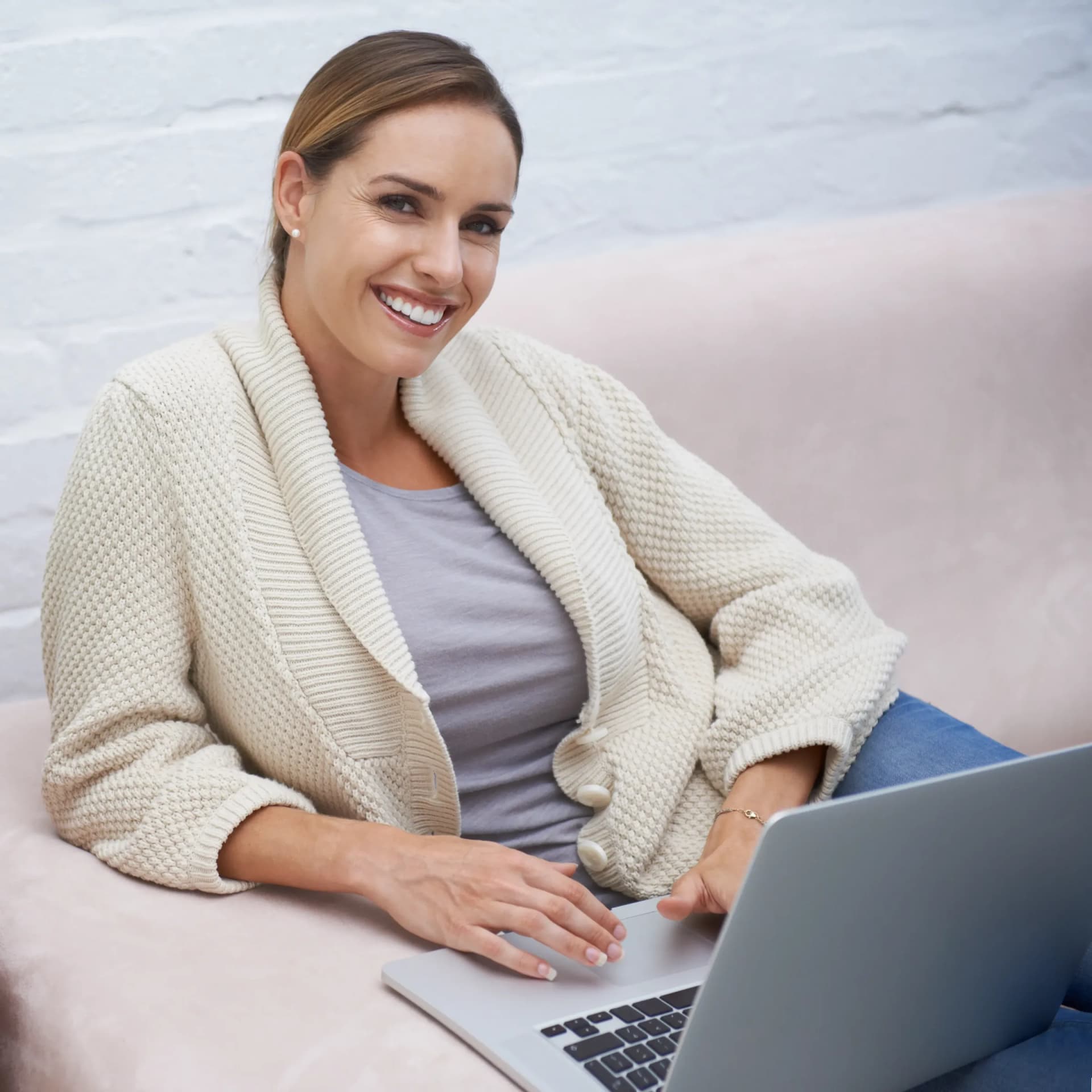 Woman on a telemedicine visit from her couch